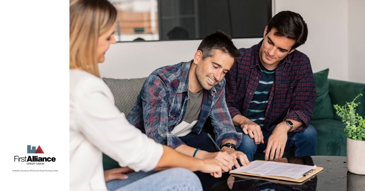 Gay couple in mortgage loan signing appointment