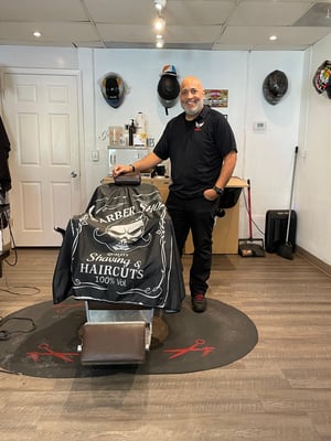 Javier inside his barbershop