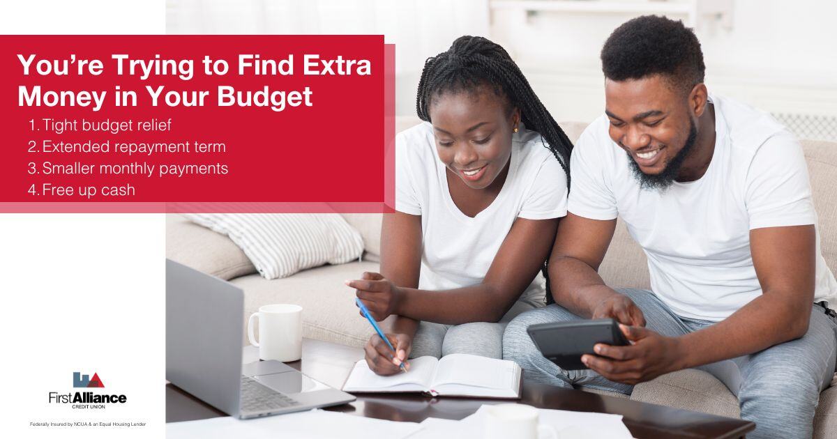 3 Reasons to Refinance Your Auto Loan - a couple doing a budget