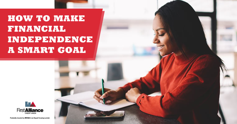 young woman using SMART goals to achieve financial independence