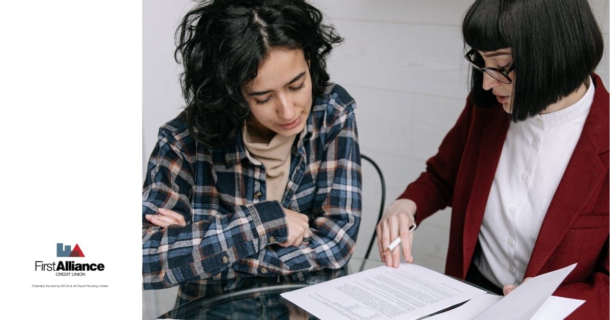 two women reviewing financial power of attorney documentation