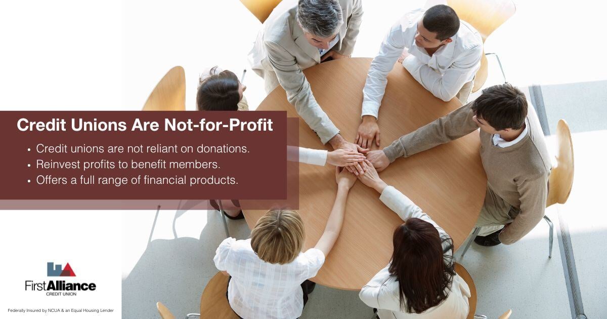 Credit Unions_ Nonprofit or Not-for-Profit - a group putting hands in the huddle