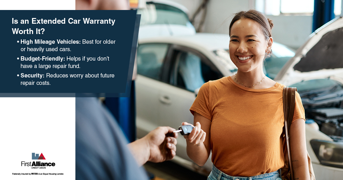 Extended Car Warranties - a person getting their key from the mechanic