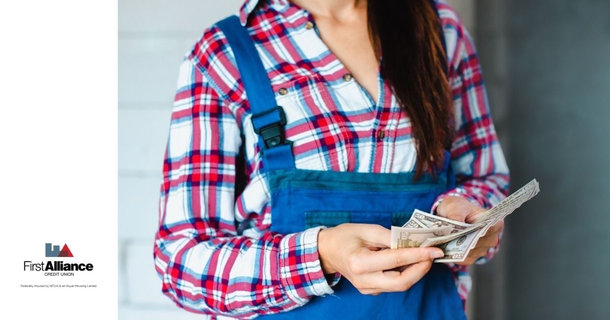 woman seasonal worker counting cash