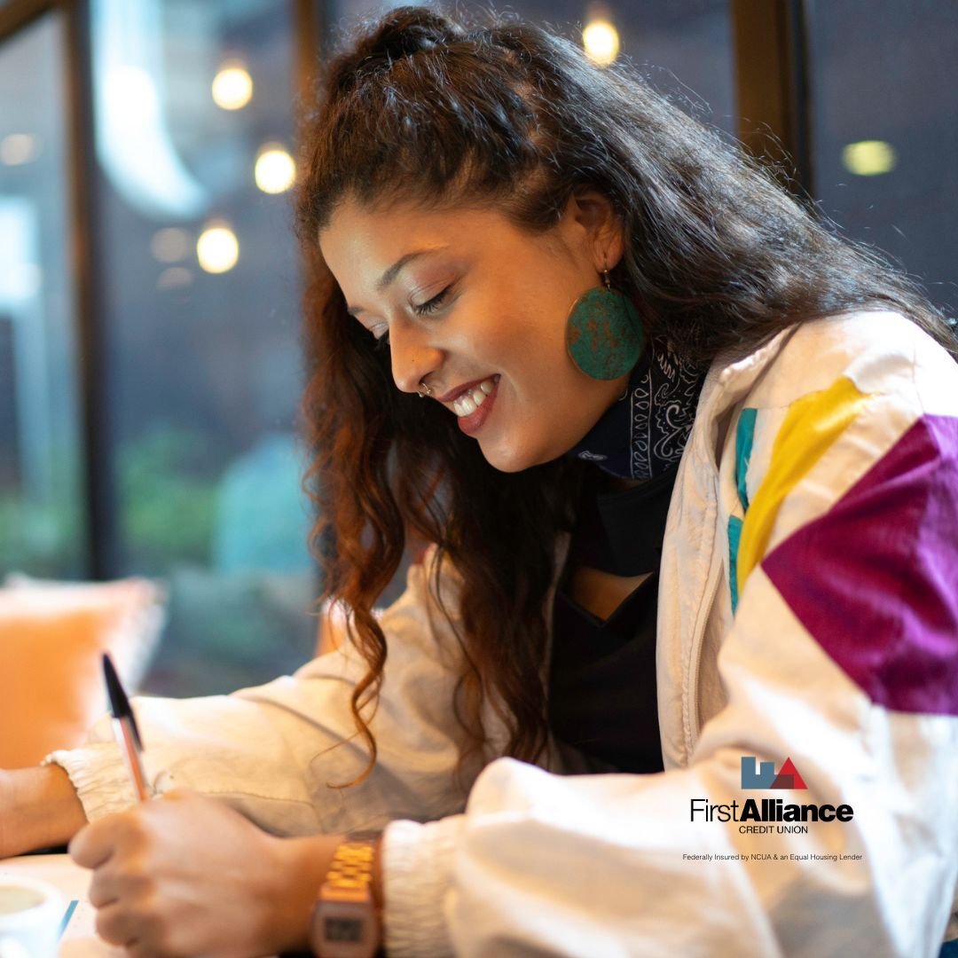 woman writing SMART financial goals