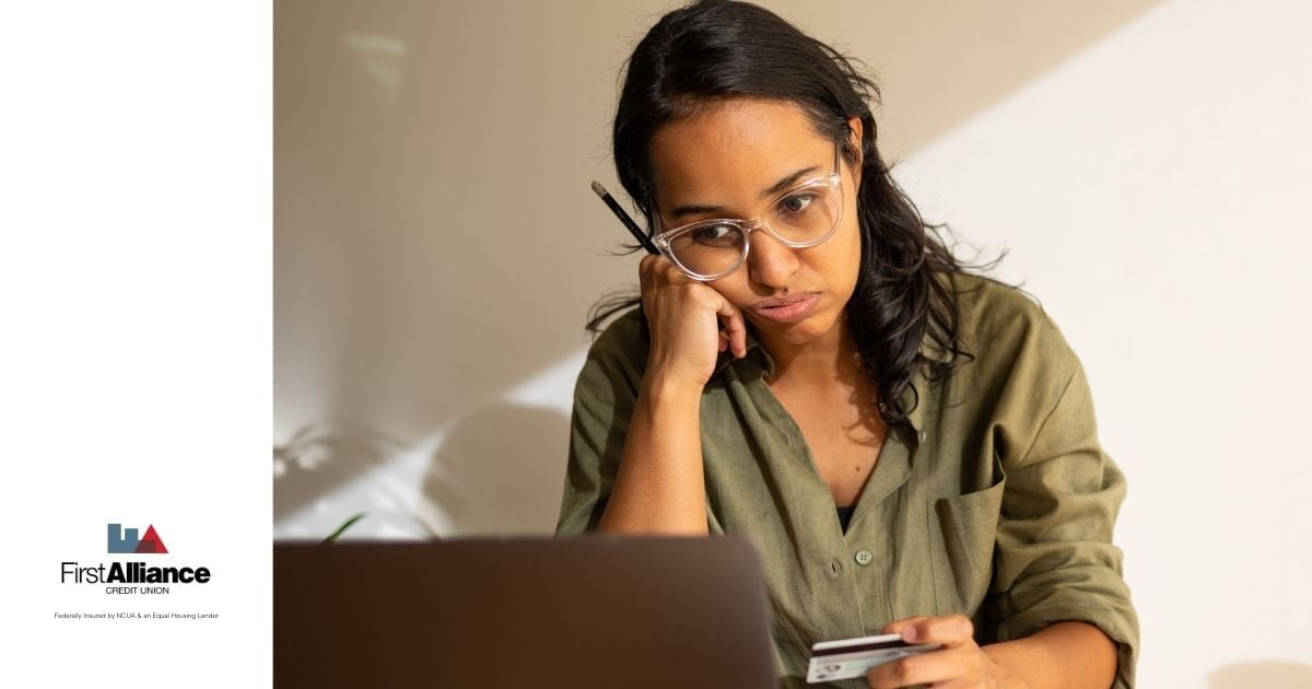 woman looking stressed from debt