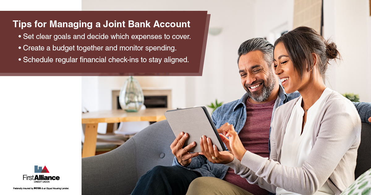 joint bank account - couple looking at their tablet