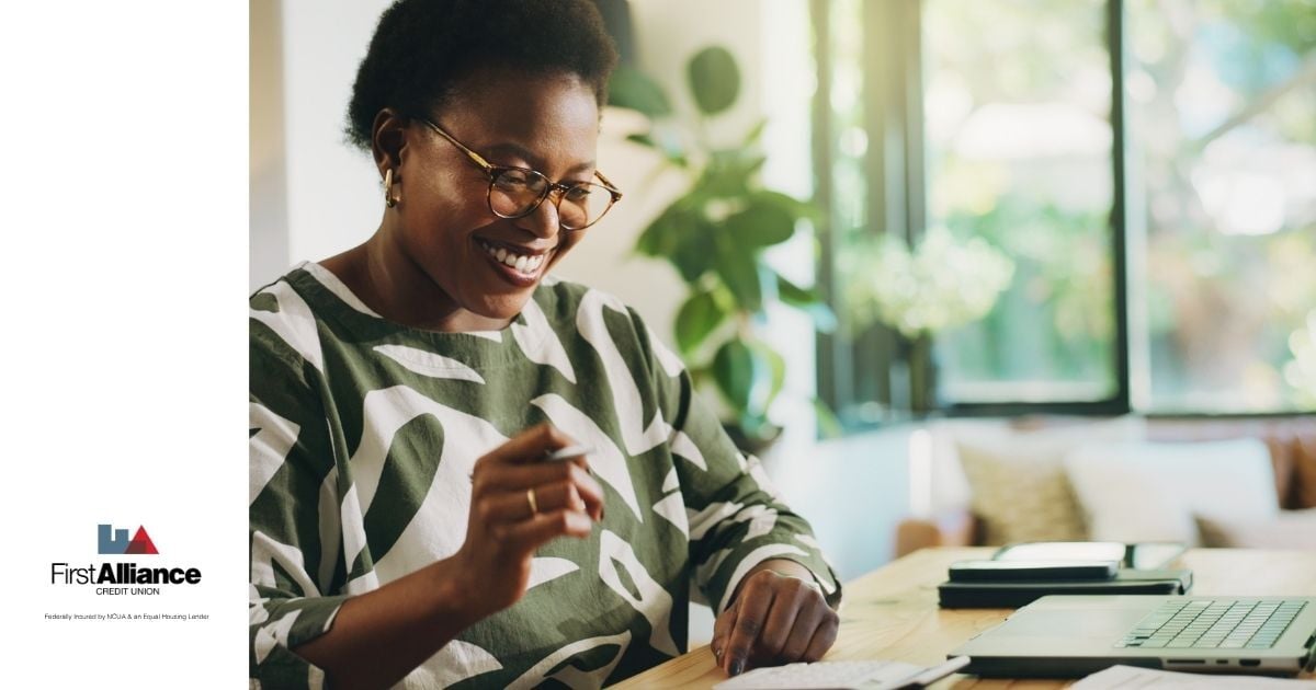 woman in green saving money for emergency fund with WINcentive Savings
