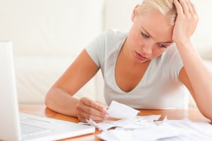 Woman examining a paper check