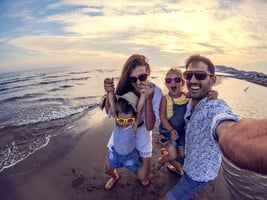 A family at a beach on vacation