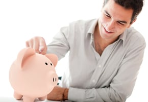 Man saving with piggy bank