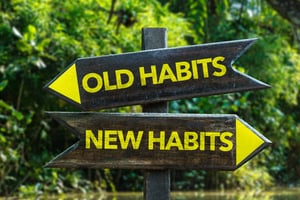 Sign showing old habits vs. new habits