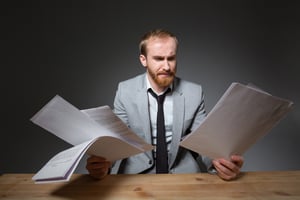 Man reading papers | First Alliance Credit Union