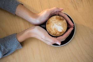 Hands on a cup of coffee