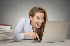 Overly excited woman on computer