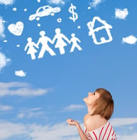 Young girl daydreaming with family and household clouds on blue sky | First Alliance Credit Union