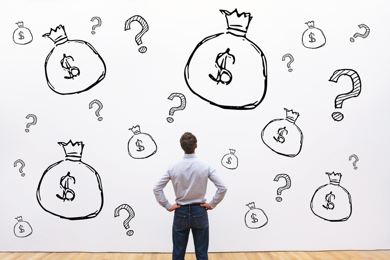 man looking at a wall of debt management solutions first alliance credit union