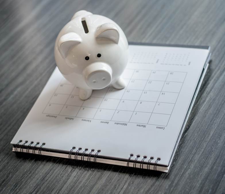 Piggy bank on a calendar