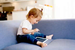Girl on Tablet | First Alliance Credit Union