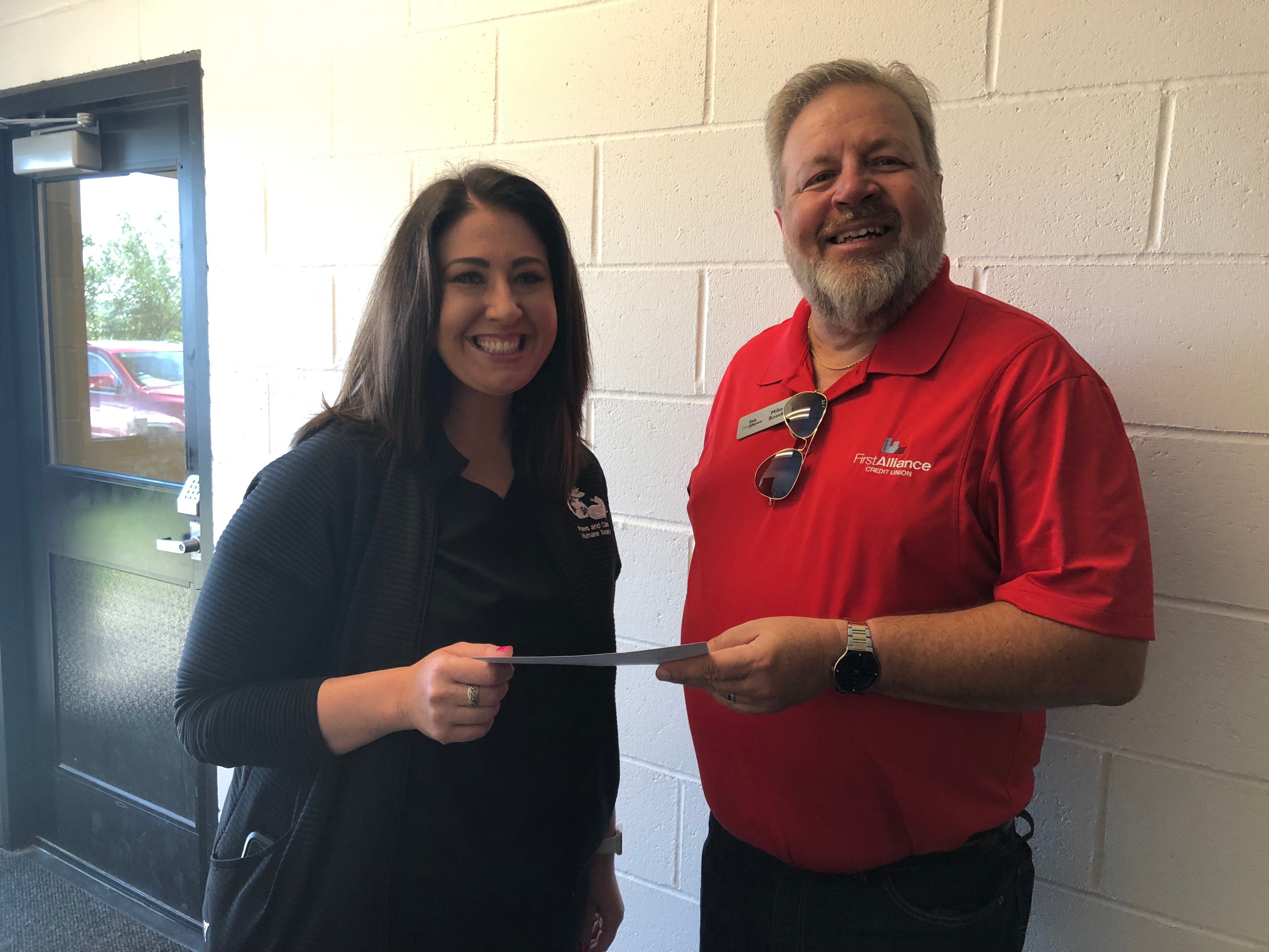 Paws and Claws Humane Society accepts donation check