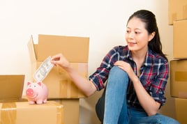 Woman saving in a piggy bank