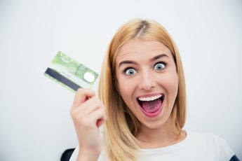 Excited teen with credit card