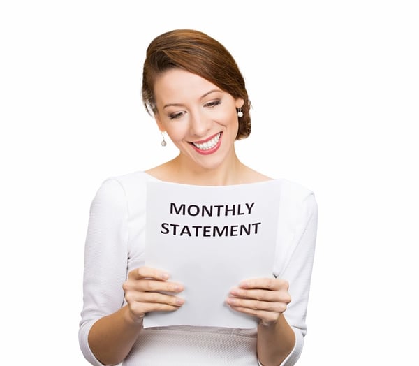 Closeup portrait happy excited young business woman looking at monthly statement glad to pay off bills, isolated white background. Positive emotions, facial expressions. Financial success, good news
