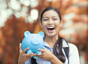 Woman laughing at money