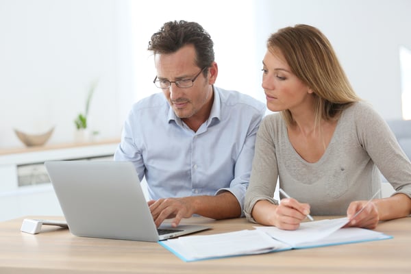 Couple at home using online banking