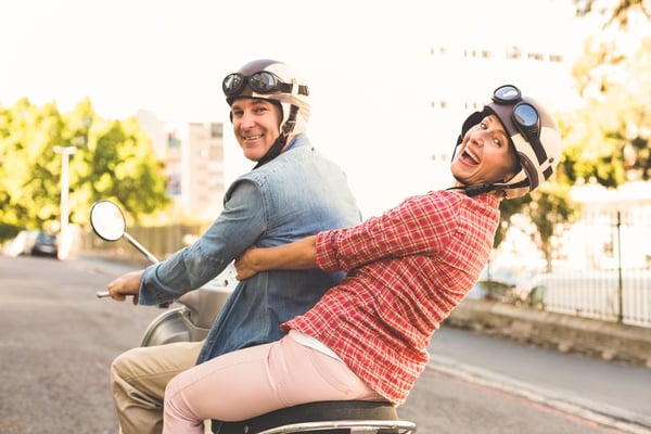 Happy retired couple on scooter | First Alliance Credit Union