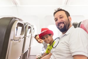 Man and kids in airplane
