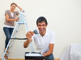 Couple painting walls