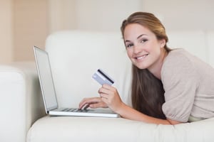 Teenager, credit card and laptop