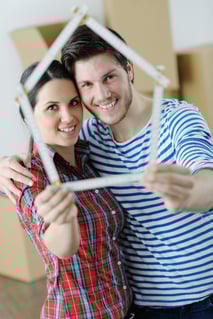 Couple looking at ruler | First Alliance Credit Union