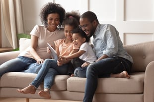Family Around Tablet | First Alliance Credit Union
