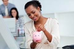 Lady Saving Money | First Alliance Credit Union