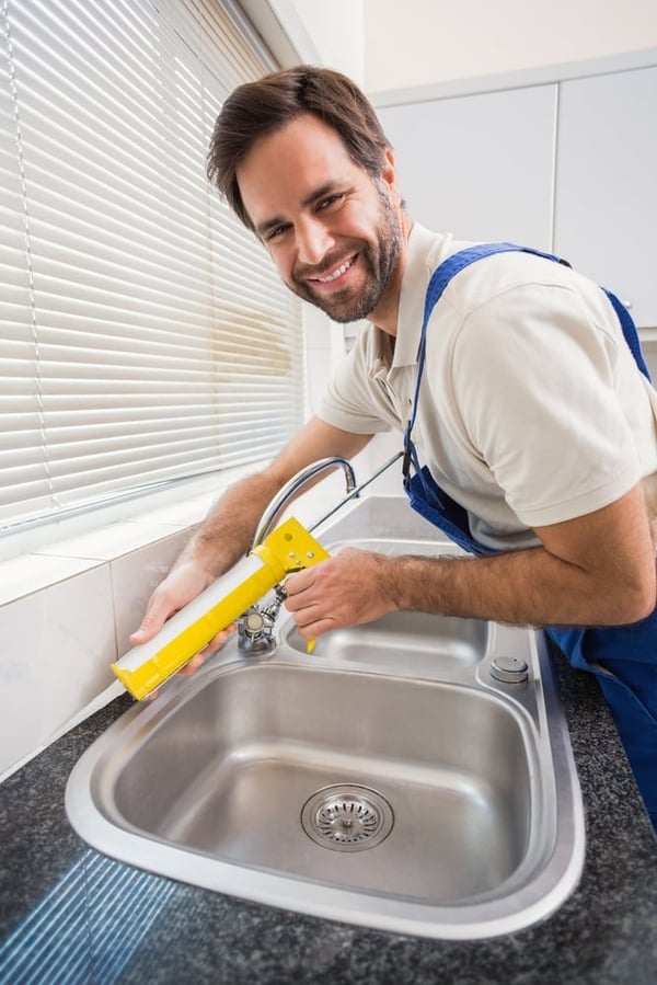 Plumber helping a neighbor | First Alliance Credit Union