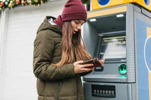 young women at ATM