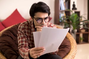Young man reviewing tax return