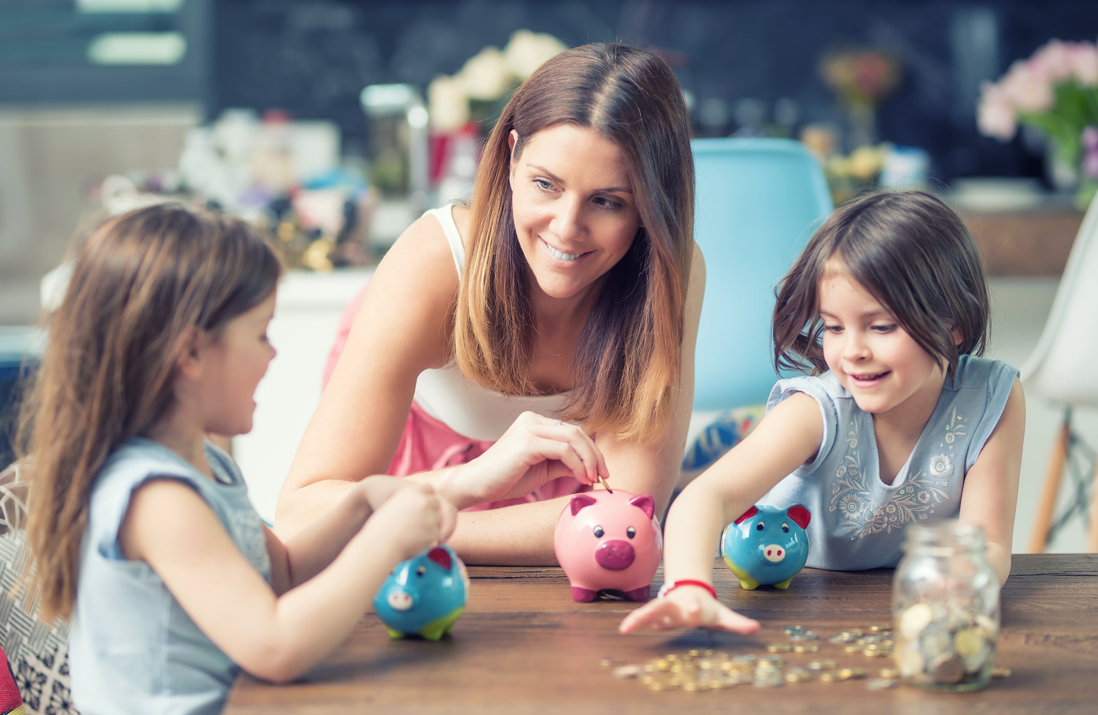 Woman teaching kids about money