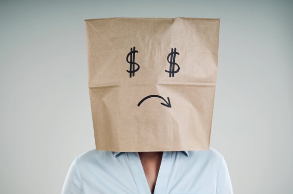 Unhappy person with dollar-sign eyes | First Alliance Credit Union