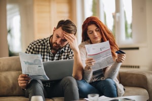 Couple reading loan information |