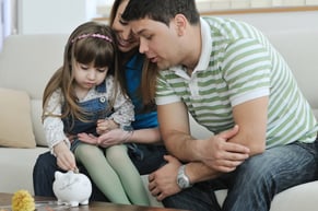 Parents teaching children about money 