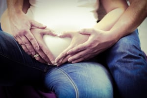 A pregnant couple | First Alliance Credit Union