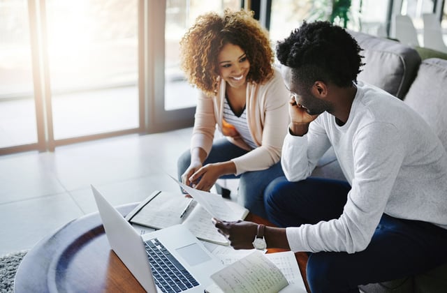 Young Couple Working On A Budget Plan