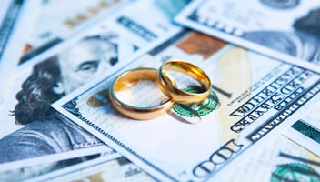 Wedding rings on cash