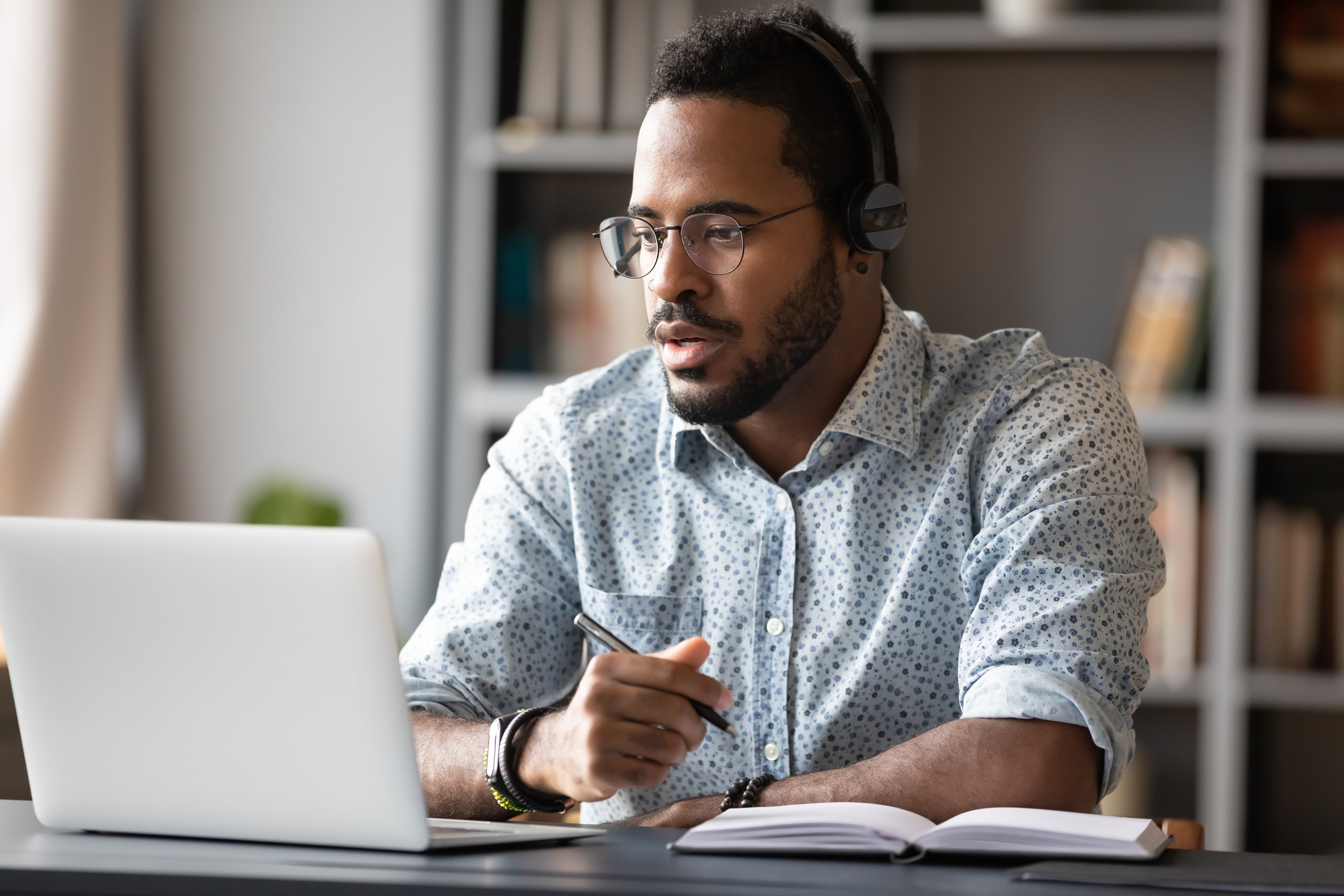 young man sitting at computer