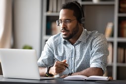 man at computer | First Alliance Credit Union 