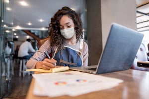 Waitress going through her bank statements | First Alliance Credit Union