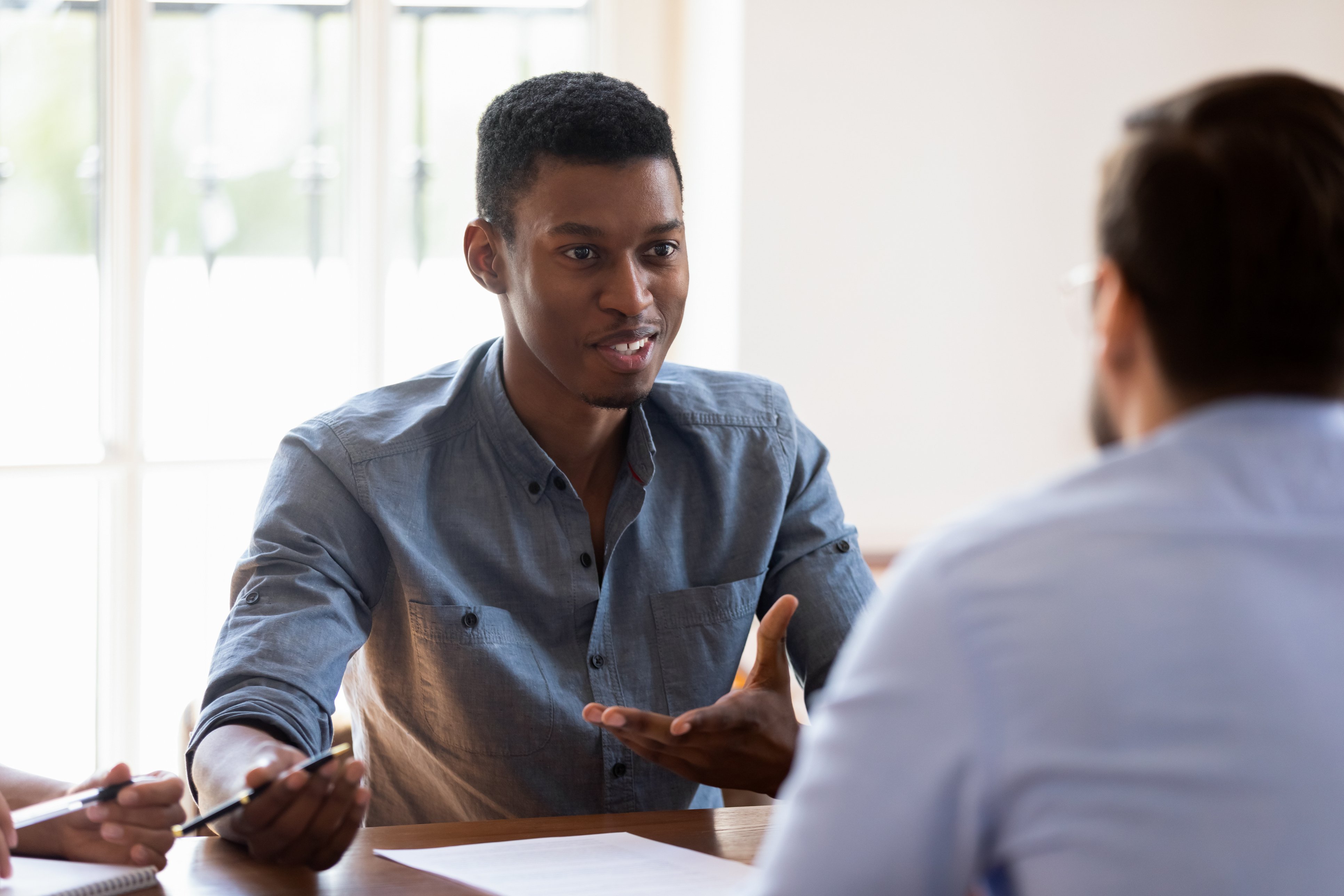 Man talking with a member experience advisor